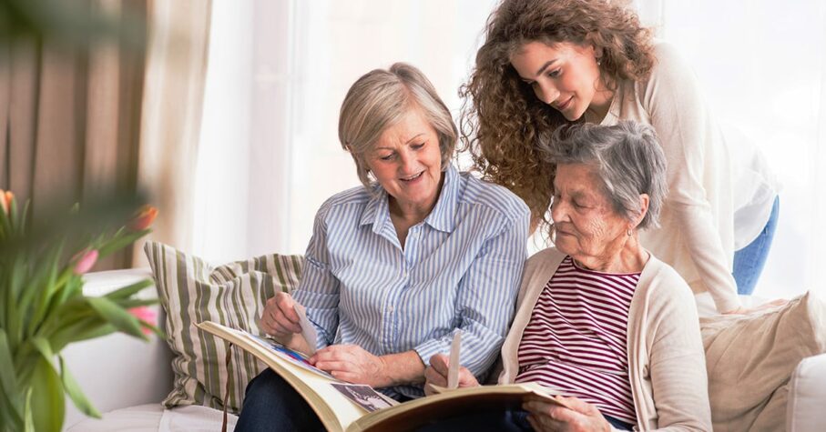 A teenage girl, mother and grandmother at home.