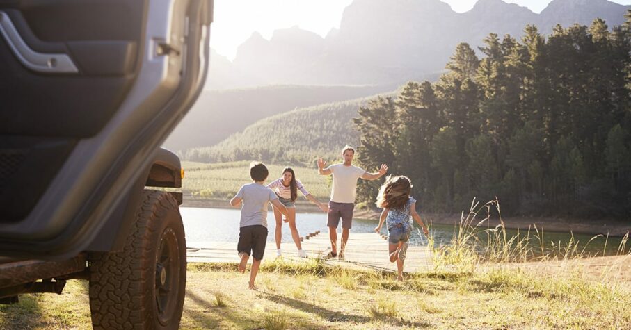 Family by the lake on a local road trip