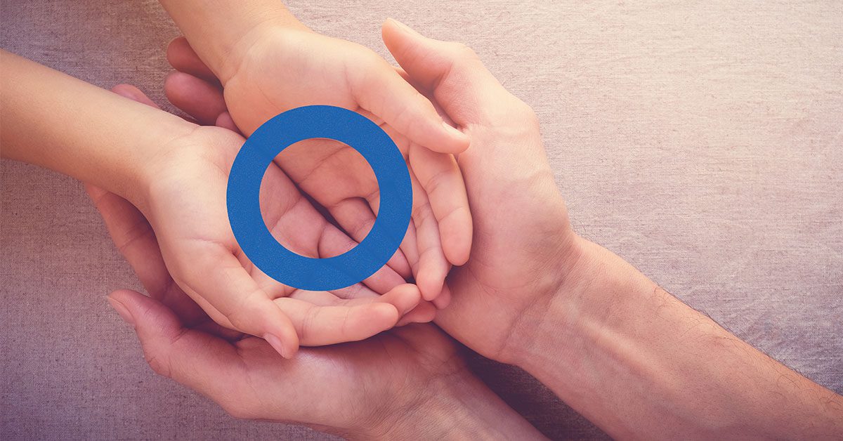 Father and Child hands together with blue circle on top