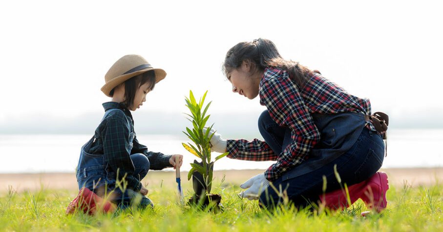 mother and child tree planting outside