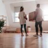 A young couple moving into their new home