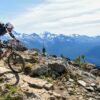 Person mountain biking on a mountain range