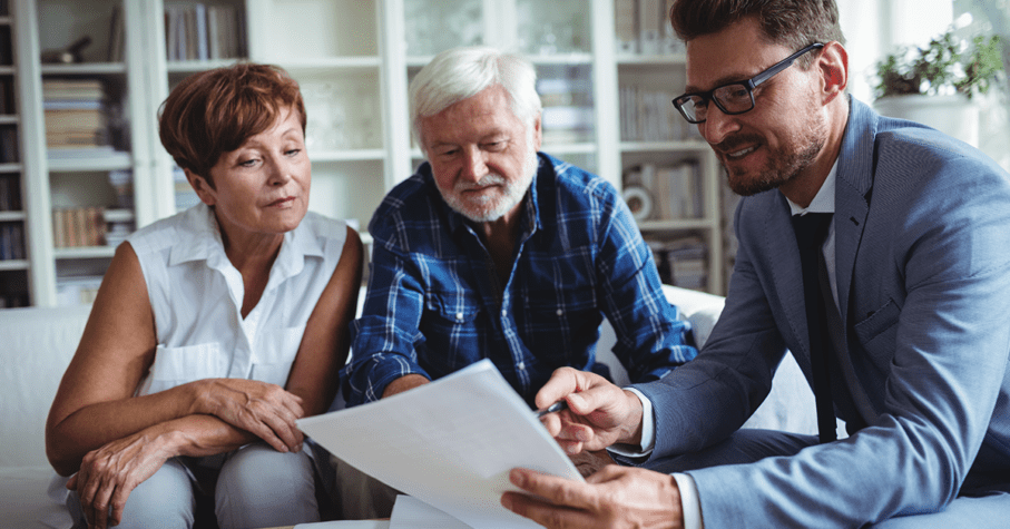 Senior couple doing estate planning with Advisor