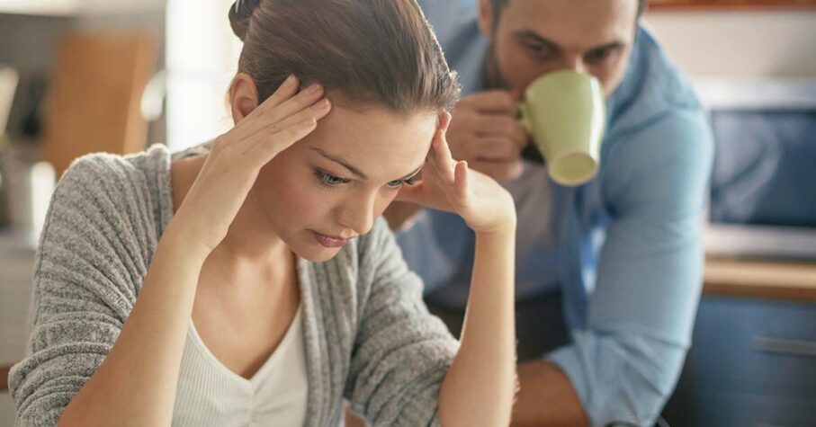 Worried couple looking at their bills